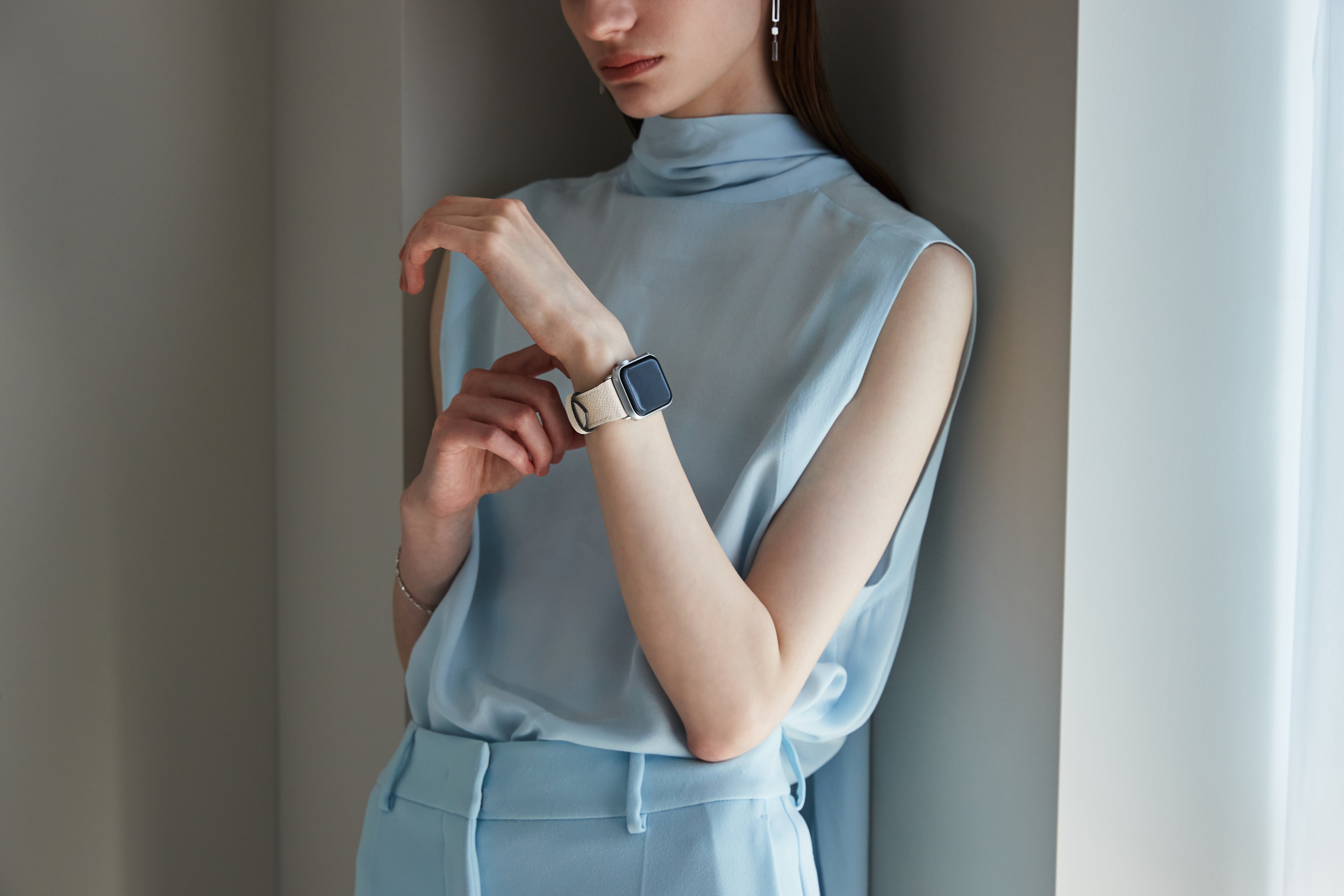 An Apple Watch with a sleek leather strap.